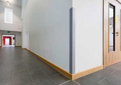 Durable 90° corner guards installed on walls in a modern home and office