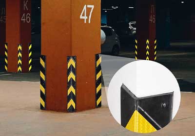 High-visibility rubber corner protectors installed in a commercial space for safety